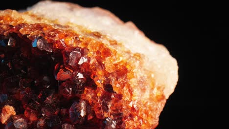 luminous detailed shot of golden citrine quartz crystal aglow against dark background