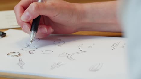 hand sketching a diamond ring