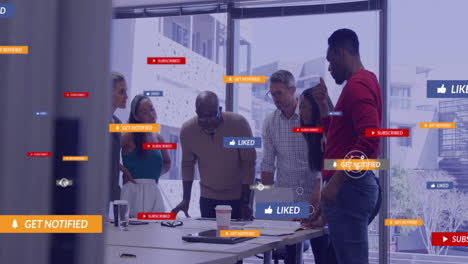 animation of social media icons with texts over diverse colleagues having meeting in office