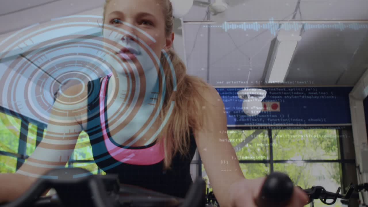 Woman cycling in gym, reaching control lever and activating blue fitness overlay, monitoring cardio