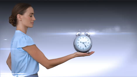 A-businesswoman-holding-alarm-clock-