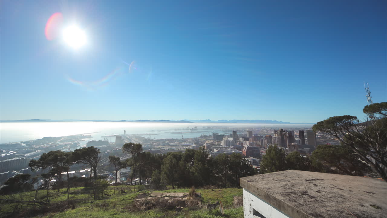 A Motion Time Lapse with views of Cape Town Centre and low rolling clouds and fog moving in the early morning