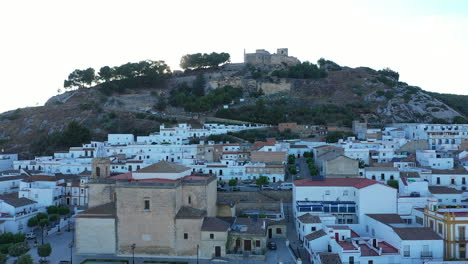 AERIAL---Sunrise-at-the-town-of-Espera,-Cadiz,-Spain,-wide-shot-backward