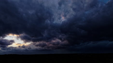 beautiful hyperlapse by drone at sunset, a storm is brewing, with lightning above big clouds, they rapidly advancing towards the camera