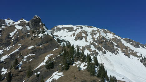 cinematic aerial of snow covered mountain ridge