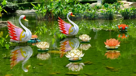 chinese swan and lotus lantern in pond