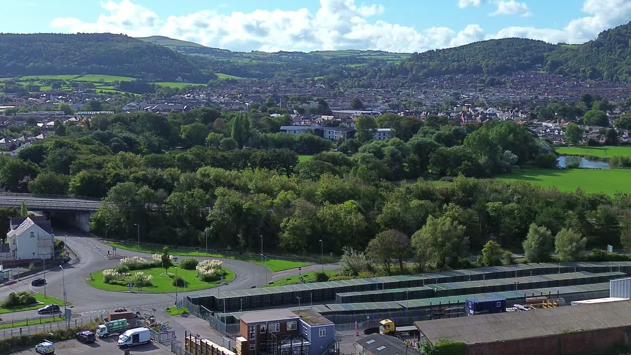Penrhos Welsh town aerial view overlooking A55 and mining mountain skyline in the distance