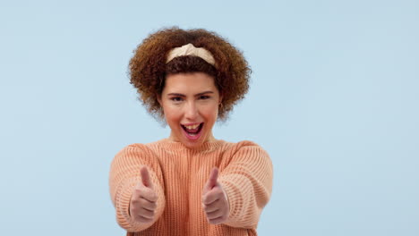 happy, face and thumbs up by woman in studio