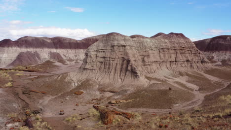 Drone-rotating-over-a-dusty-badland-in-Arizona