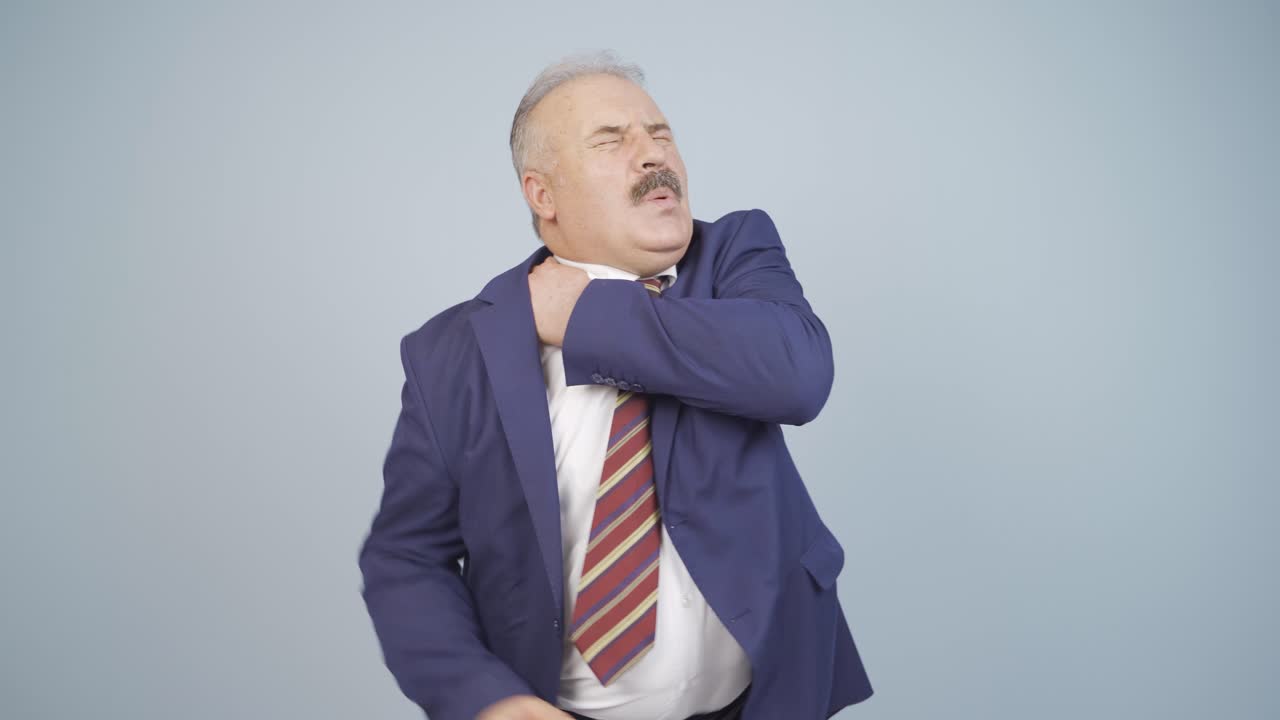 Businessman's shoulders hurt.
