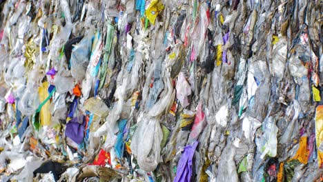 stack of different types of large garbage dump, plastic bags, and landfill full of trash, environmental pollution, medium close up shot tilt up