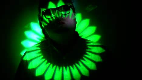 portrait of a fat man in a multicolored light beam.