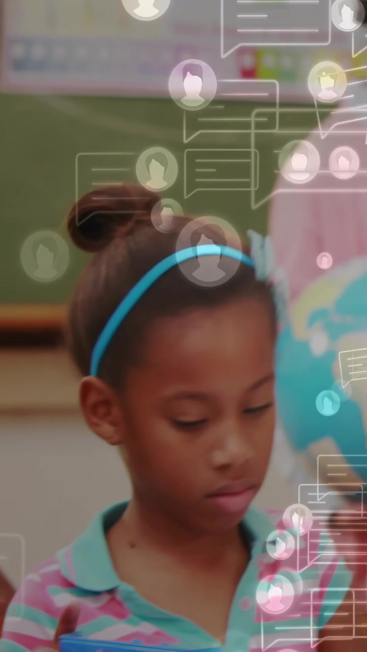 Vertical video: Girl writing cam panning, teacher globe, kid raising paper, chat bubbles over class