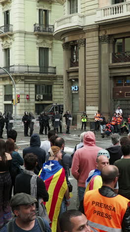 barcelona - spain - october 18 2019 : riot police clash with protestors at the general strike in via laietana, barcelona in vertical