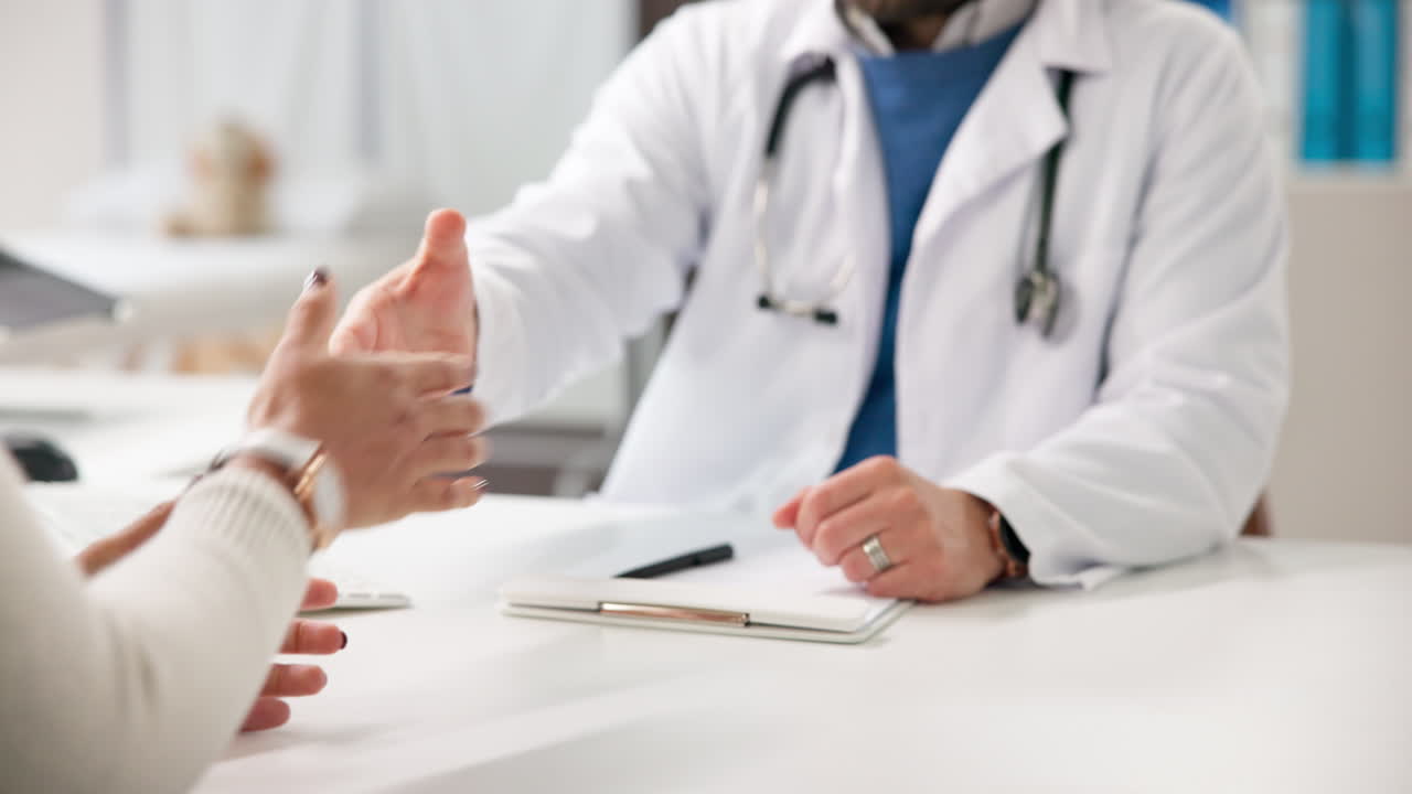 Doctor Consulting with Patient in Office
