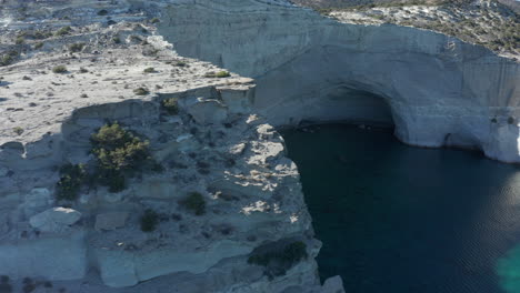 Aerial-over-Mountain-revealing-Paradise-Bay-with-Caves