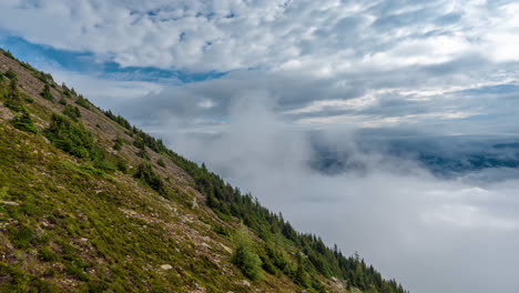 timelapse, clods and fog moving above mount st