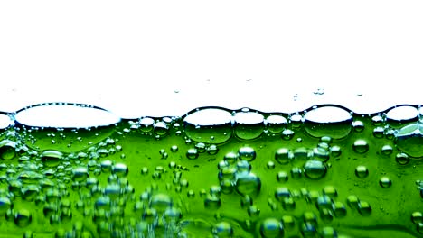 water oil bubbles  behind glass background