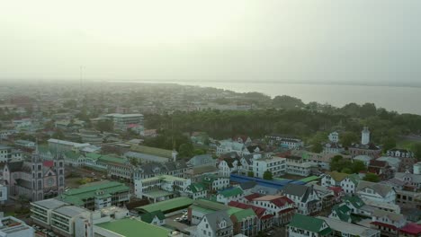 Aerial:-beautiful-Paramaribo-city,-capital-of-Suriname-at-sunset