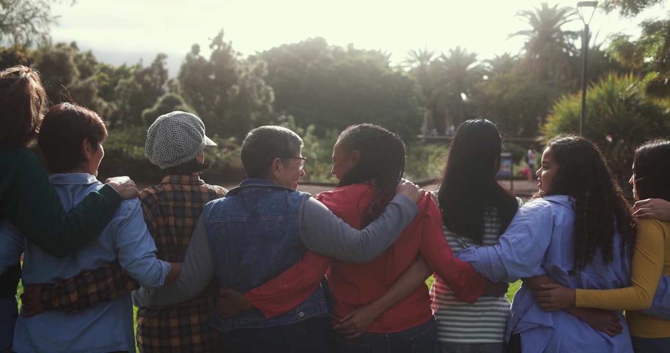 Happy Diverse Women Friends Standing Arm in Arm in Park