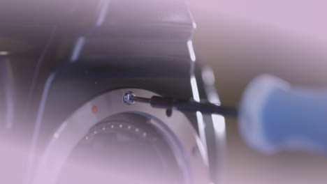 Hand-repairing-vintage-photo-camera