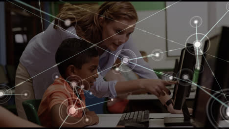 Animation of network of connections over diverse boy and female teacher using computers at school