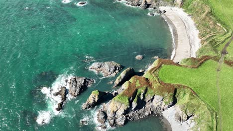 Ireland-coast-drone-looking-down-on-spectacular-scenery-on-The-Copper-Coast-Waterford-wild-and-remote