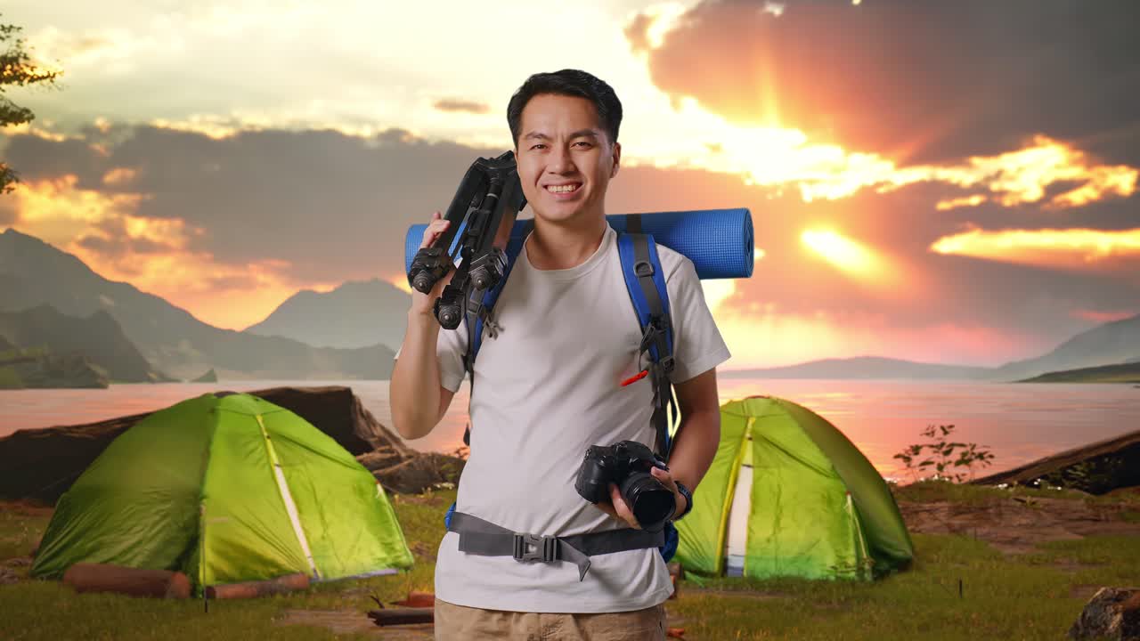 Man Camping with Camera at Sunset