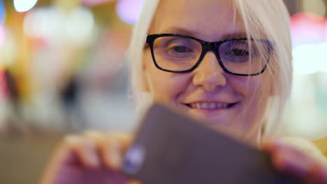 woman takes selfie at night