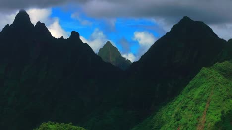teahupoo vallee de tautira river valley bay vaitepiha village tahiti island french polynesia aerial drone jagged mountain aorai peak canyon aorai taiarapu taravao north shore cloudy parallax backwards