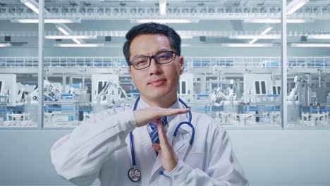 Close Up Of Asian Male Doctor With Stethoscope Doing Time Out Gesture With Hands In Laboratory
