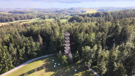 aerial drone shot flying down and tilting up showing the pfannenstiel observation tower