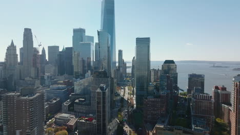 Forwards-fly-above-buildings-in-city.-Elevated-view-of-modern-tall-skyscrapers-in-Financial-district.-Manhattan,-New-York-City,-USA