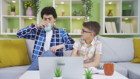 Two-cute-brothers-pretending-to-be-businessmen-at-home-and-laughing.