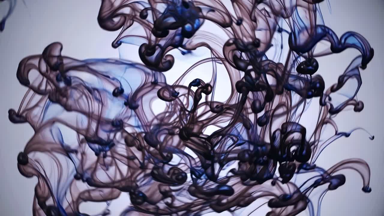 Dark blue and purple ink is swirling in water, creating abstract patterns against a white background, resembling a cosmic dance or an underwater fantasy scene