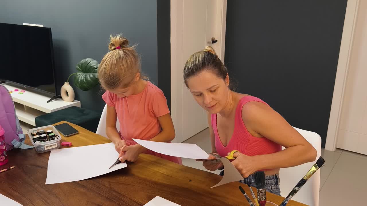 Mother and Daughter Doing Arts and Crafts at Home