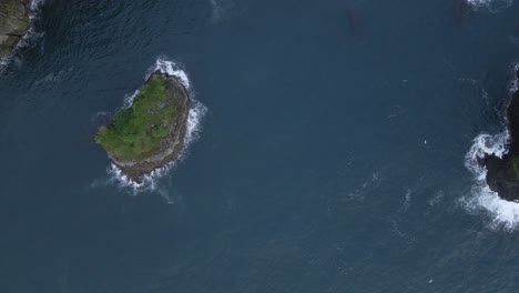 Aerial-high-angle-view-trucking-sideways-high-above-the-rugged-and-rocky-coast-of-central-America