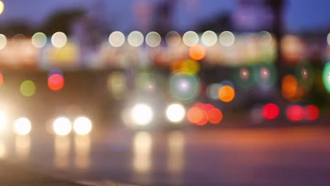 Blurry-background-of-vehicle-traffic-with-lights-and-bokeh,-still-background-with-moving-cars