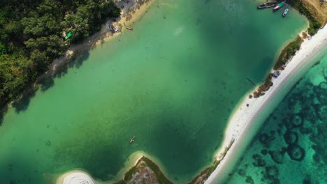 Beautiful-azure-calm-sea-water-with-natural-wavebreaker,-on-the-tropical-island