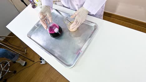 scientist conducts a vibrant chemical experiment with beaker and food coloring on a lab table