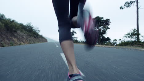 woman running on road close up shoes steadicam shot