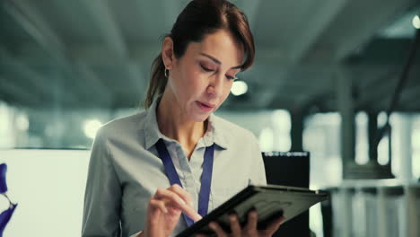 businesswoman working on tablet in office