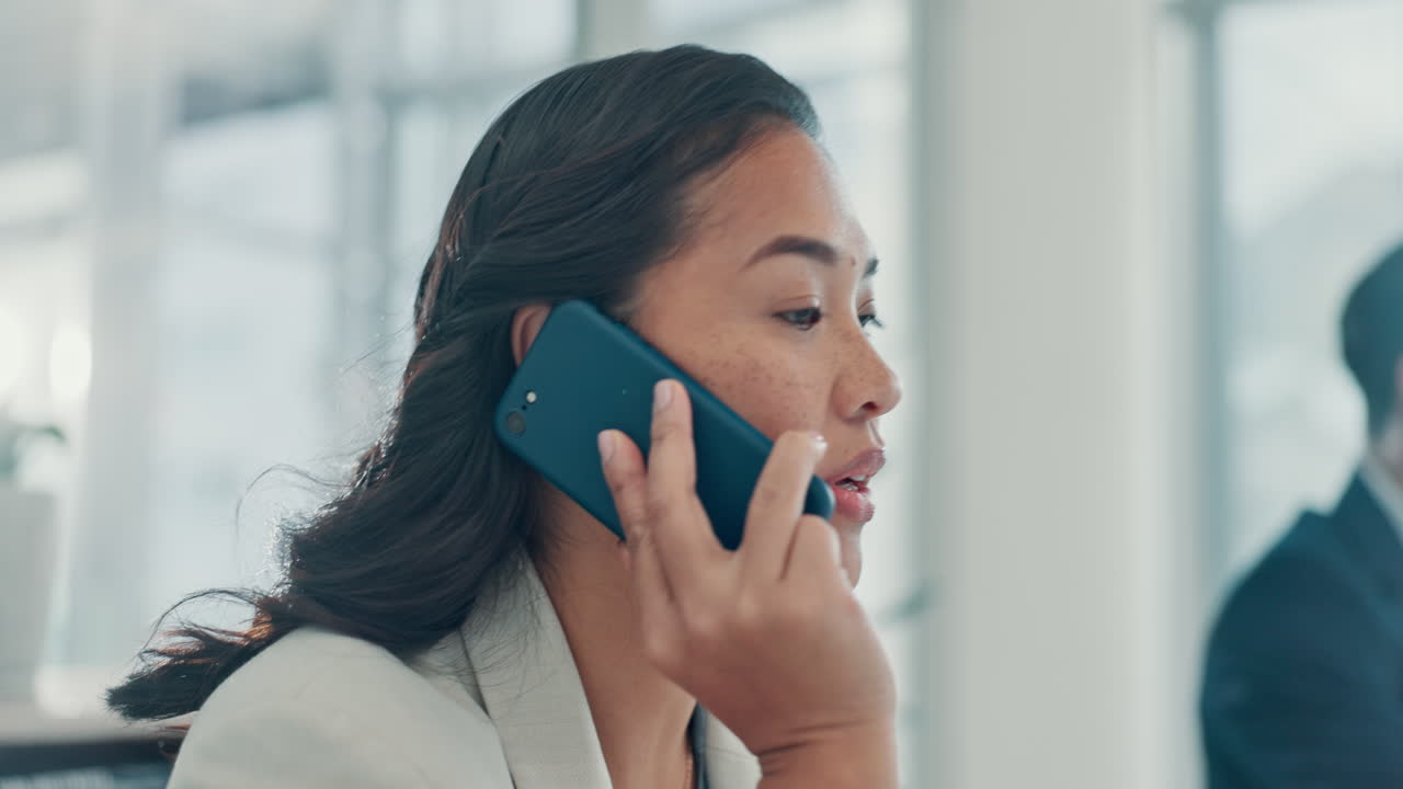 Professional Woman Talking on Smartphone and Checking Time in Office