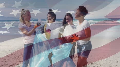 composite video of american flag against group of diverse female volunteers cleaning the beach