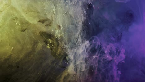 purple and yellow colored nebula underwater swirling and falling down