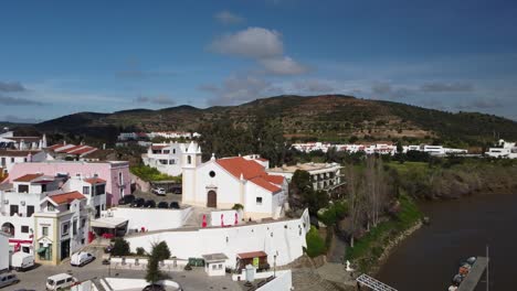 slow motion aerial view of alcoutim (algarve city - portugal). drone movement into the church at the guadiana river