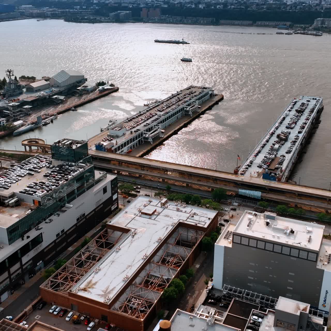 Parking lots of New York from aerial view. Car parks on the roofs of the building and piers
