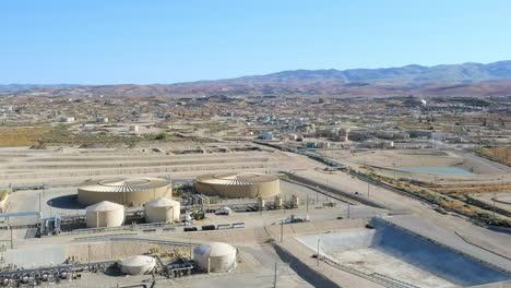 aerial view over oil refinery in missouri triangle, california, usa - drone shot