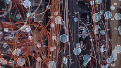 animation of digital icons and numbers changing over cables in computer servers in background