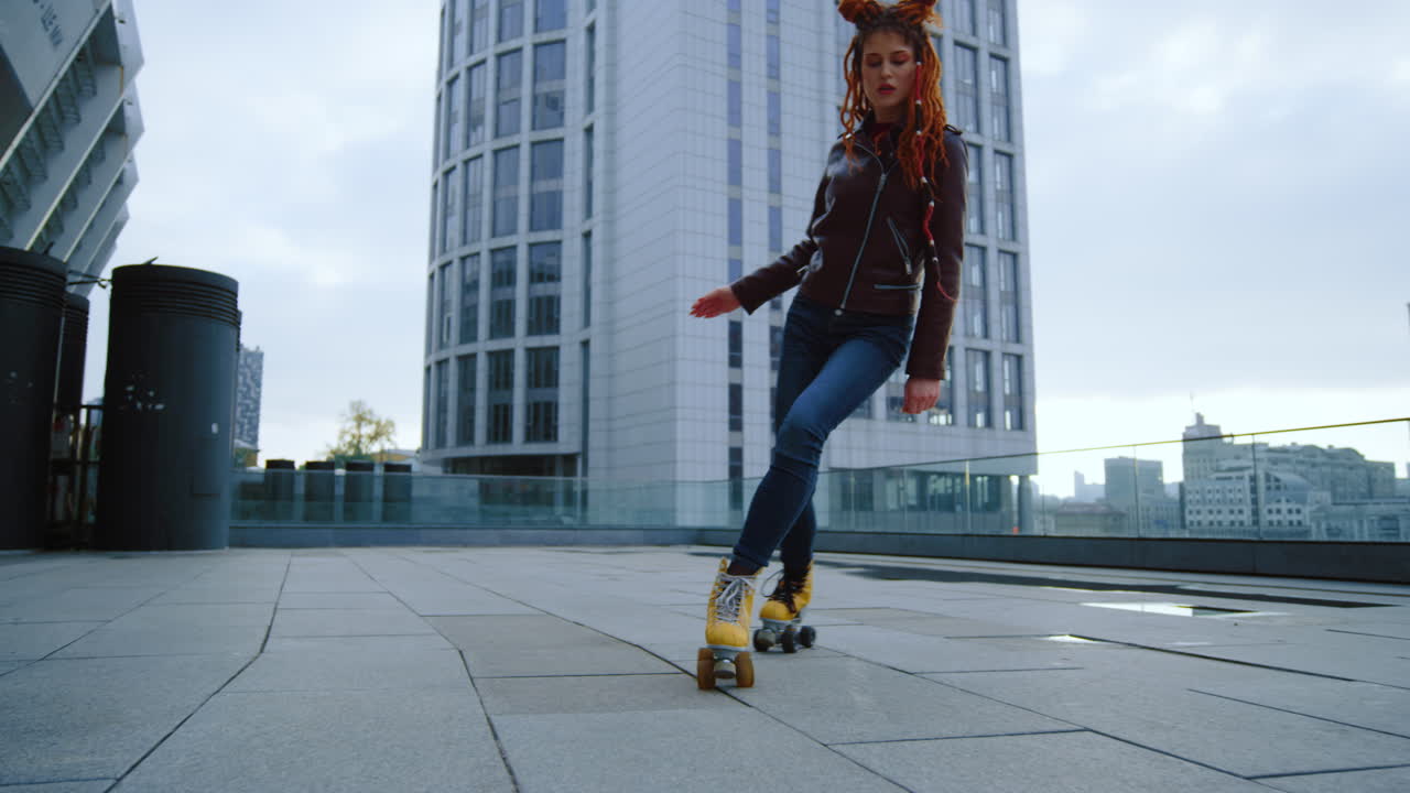 Focused roller skater riding outside. Active woman training on rollerblades.